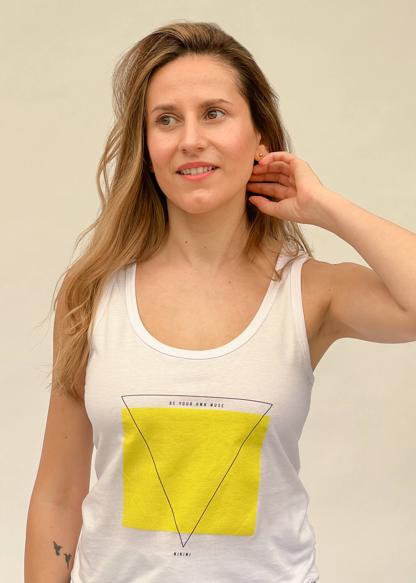 graphic white tank top with bold minimalistic print and text that reads ¨be your own muse¨